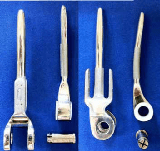 Total elbow replacement implant components showing humeral and ulnar stems