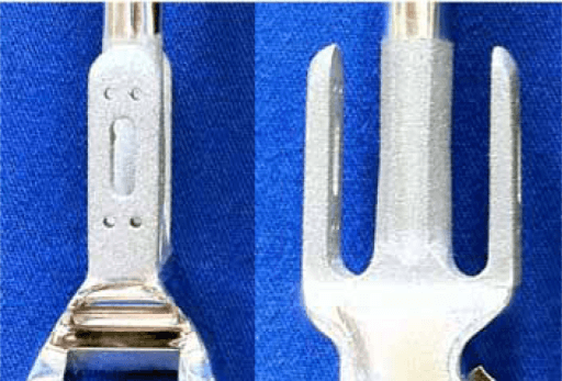 Close-up articulation of total elbow replacement showing polyethylene bushing