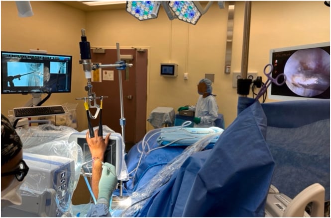 Operating room setup for concurrent wrist arthroscopy and mini C-arm fluoroscopy using a traction tower
