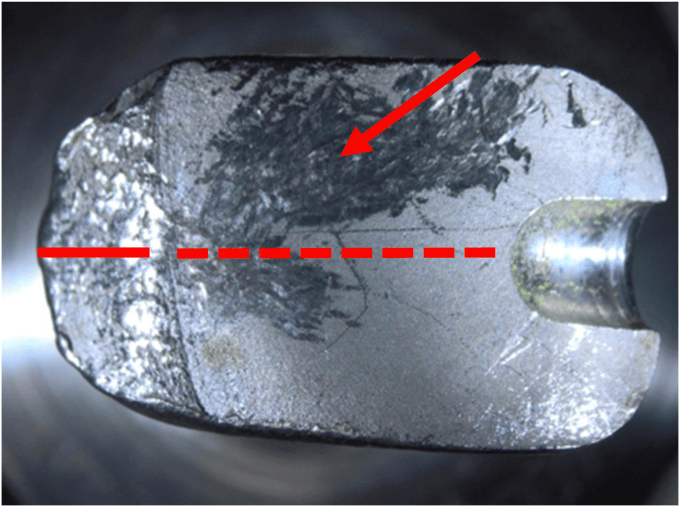 Macroscopic fracture plane of an implant beside its introducer hole