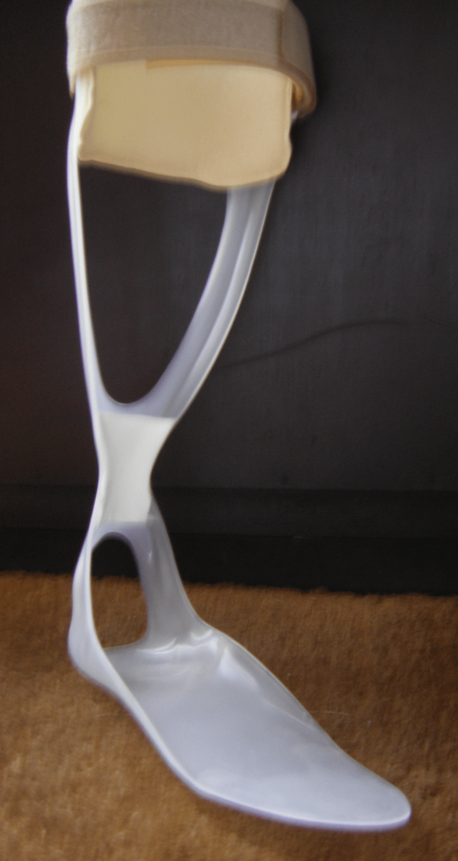 Photograph of a white plastic posterior leaf spring ankle-foot orthosis