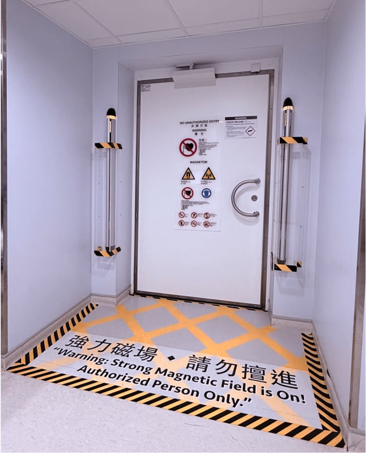 MRI Zone IV scanner-room entrance with warning markings and a ferromagnetic detection portal.