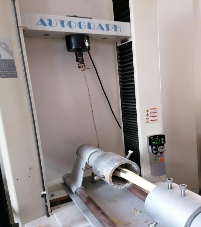 Synthetic proximal tibial fracture construct mounted horizontally for torsional testing