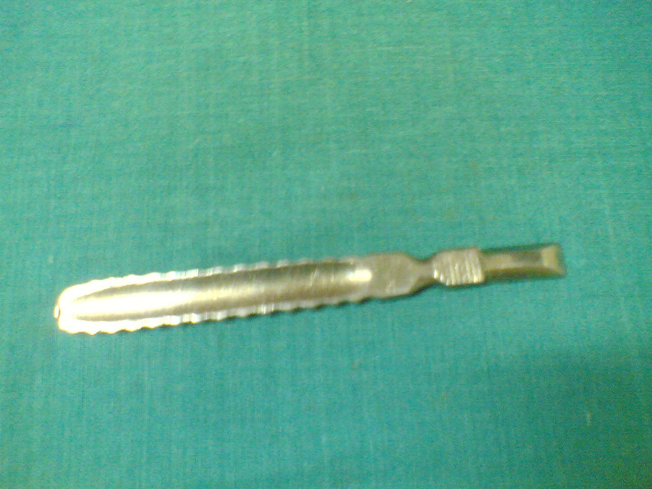 Double-ended Farabeuf periosteal elevator with broad and narrow working ends.