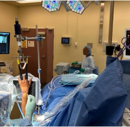 Operating-room set-up for wrist arthroscopy with the hand suspended in finger traps from a traction tower